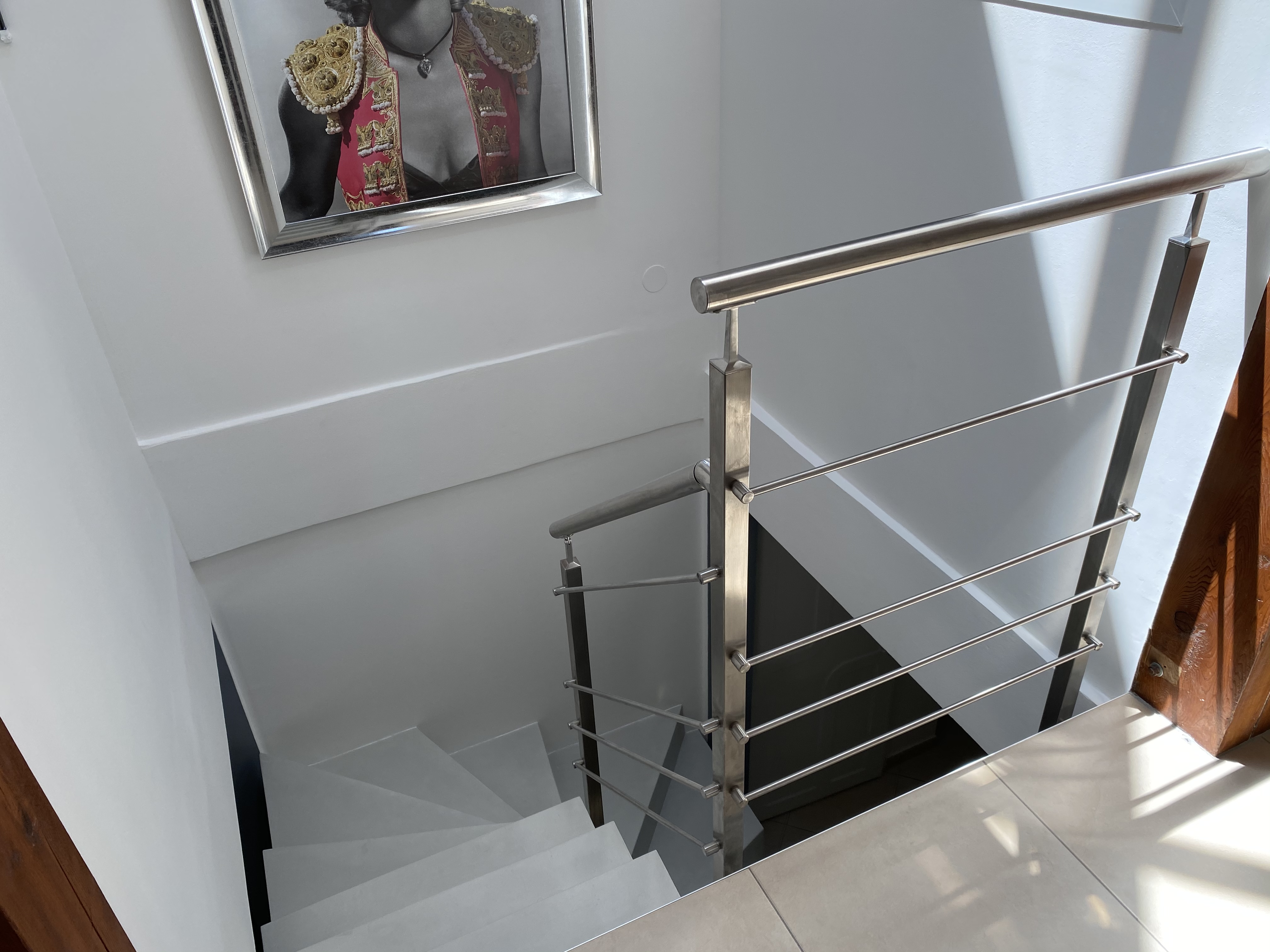 Main courante ronde dans un escalier